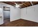 View of a room in the basement with wood-look floors, white walls, and a ceiling fan at 2763 Macby Walk, Marietta, GA 30066