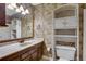 Vintage styled bathroom with marble countertops and wallpapered walls and ample storage at 2763 Macby Walk, Marietta, GA 30066