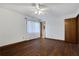 Bedroom with hardwood floors, natural light from window, and access to the ensuite bathroom at 2763 Macby Walk, Marietta, GA 30066