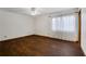 Spacious empty bedroom with dark wood-look floors and natural lighting at 2763 Macby Walk, Marietta, GA 30066