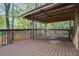Spacious back deck with a view of a wooded area and a covered area at 2763 Macby Walk, Marietta, GA 30066