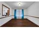Bright and airy dining room with hardwood floors and teal accents at 2763 Macby Walk, Marietta, GA 30066