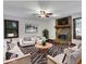 Inviting living room featuring a stone fireplace, a ceiling fan, and neutral-toned furniture, creating a cozy atmosphere at 2763 Macby Walk, Marietta, GA 30066