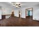 Spacious living room featuring wood floors, a stone fireplace, and a railing, creating a cozy atmosphere at 2763 Macby Walk, Marietta, GA 30066