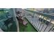 Relaxing balcony with chairs and artificial turf, perfect for enjoying city views at 3324 Peachtree Ne Rd # 905, Atlanta, GA 30326