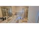 Bathroom featuring double sink vanity, tub and separate glass shower at 3324 Peachtree Ne Rd # 905, Atlanta, GA 30326