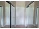 Neutral hallway featuring two mirrored closet doors and a white door at 3324 Peachtree Ne Rd # 905, Atlanta, GA 30326