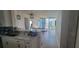 Open-concept kitchen with sleek white cabinets, modern appliances and eat-in bar at 3324 Peachtree Ne Rd # 905, Atlanta, GA 30326