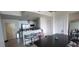Open kitchen and dining area with modern fixtures and barstool seating at 3324 Peachtree Ne Rd # 905, Atlanta, GA 30326
