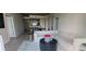 Bright, inviting living room with a large modern sofa and a view of the kitchen at 3324 Peachtree Ne Rd # 905, Atlanta, GA 30326