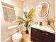 Updated bathroom with a modern vanity, sleek fixtures, and stylish mirror at 380 Amal Sw Dr, Atlanta, GA 30315
