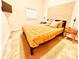 Cozy bedroom featuring a comfortable bed, a TV, and natural wood nightstands at 380 Amal Sw Dr, Atlanta, GA 30315