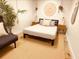 Inviting bedroom with stylish décor, including a comfy futon sofa and natural textures at 380 Amal Sw Dr, Atlanta, GA 30315