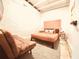 Comfortable bedroom with a queen size bed, a sitting area, and vintage decor at 380 Amal Sw Dr, Atlanta, GA 30315
