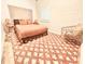 Cozy bedroom with natural light, textured rug, and neutral tones at 380 Amal Sw Dr, Atlanta, GA 30315