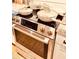Stainless steel Bosch oven with glass cooktop and modern pots and pans at 380 Amal Sw Dr, Atlanta, GA 30315