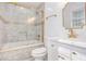 Stylish bathroom with white vanity, bathtub, glass shower doors, and gold fixtures at 2760 Swansea Ct, College Park, GA 30349