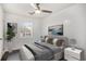 Cozy bedroom with neutral decor, two windows and grey floors at 2760 Swansea Ct, College Park, GA 30349