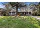 Charming single-story home with a well-maintained lawn, inviting curb appeal, and a bright yellow front door at 2760 Swansea Ct, College Park, GA 30349