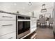 Close up of the kitchen island and built-in stainless steel oven; dark hardwood flooring at 2760 Swansea Ct, College Park, GA 30349