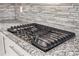 Granite kitchen countertops with a stainless steel gas cooktop and tile backsplash at 2760 Swansea Ct, College Park, GA 30349