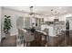 Well-lit kitchen area with a stainless steel refrigerator and a connected dining space at 2760 Swansea Ct, College Park, GA 30349