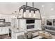 Bright kitchen features white cabinetry, granite counters, stainless appliances and an adjacent dining/living area at 2760 Swansea Ct, College Park, GA 30349
