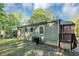 A view of the backyard from the side of the home with porch at 299 Ard Nw Pl, Atlanta, GA 30331