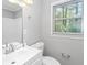 Bathroom featuring new vanity, mirror, and natural light at 299 Ard Nw Pl, Atlanta, GA 30331