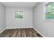 Bedroom features natural light and wood-look flooring at 299 Ard Nw Pl, Atlanta, GA 30331