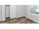 A neutral room has hardwood floors, a window, and a closet at 299 Ard Nw Pl, Atlanta, GA 30331