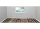 Empty room shows hardwood floors, natural light, and neutral paint at 299 Ard Nw Pl, Atlanta, GA 30331