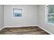 Bedroom showing hardwood floors, neutral paint, and natural light at 299 Ard Nw Pl, Atlanta, GA 30331