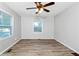 A bedroom with great natural light, ceiling fan, and wood-look flooring at 299 Ard Nw Pl, Atlanta, GA 30331