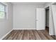 Bedroom features freshly painted gray walls and wood-look flooring at 299 Ard Nw Pl, Atlanta, GA 30331