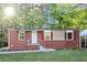 Charming brick home with red shutters and a well-maintained lawn at 299 Ard Nw Pl, Atlanta, GA 30331
