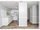 An airy kitchen shows white cabinets, hardwood floors, and modern appliances at 299 Ard Nw Pl, Atlanta, GA 30331