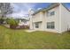 View of home's backyard with a small patio and a privacy fence at 3943 Brookgate Ct, Ellenwood, GA 30294