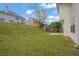 Grassy backyard featuring a privacy fence and a small patio at 3943 Brookgate Ct, Ellenwood, GA 30294