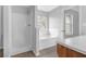 Bright bathroom with a separate shower and bathtub, perfect for a relaxing retreat at 3943 Brookgate Ct, Ellenwood, GA 30294