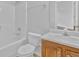 Bathroom featuring a shower/tub combo with oak vanity and sink at 3943 Brookgate Ct, Ellenwood, GA 30294