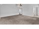Spacious bedroom featuring neutral paint, plush carpet, and a ceiling fan at 3943 Brookgate Ct, Ellenwood, GA 30294
