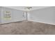 Spacious bedroom features two windows for natural light and neutral carpet and paint at 3943 Brookgate Ct, Ellenwood, GA 30294