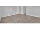 Neutral carpeted bedroom with two doors leading to other rooms at 3943 Brookgate Ct, Ellenwood, GA 30294