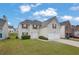 Charming two-story house with a well-kept lawn, two-car garage, and a welcoming front entrance at 3943 Brookgate Ct, Ellenwood, GA 30294