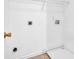 Laundry room equipped with hookups, shelving, and tile flooring at 3943 Brookgate Ct, Ellenwood, GA 30294