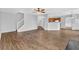 Open floor plan with hard surface floors, view of staircase and view into kitchen at 3943 Brookgate Ct, Ellenwood, GA 30294