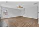 Large living room featuring hard surface floors, ceiling fan, and neutral paint at 3943 Brookgate Ct, Ellenwood, GA 30294