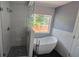 Modern bathroom featuring a glass-enclosed shower and freestanding tub at 7675 Rose Ln, Cumming, GA 30040