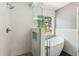 Modern bathroom featuring a glass-enclosed shower and freestanding tub at 7675 Rose Ln, Cumming, GA 30040